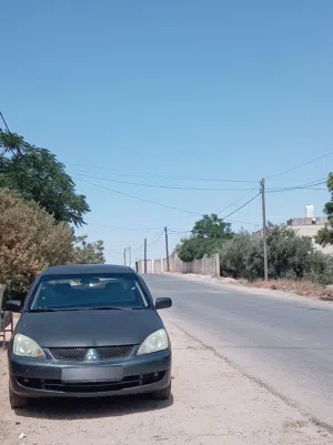 ميتسوبيشي لانسر 2007 الملا وارد الكويت ماتور 1600 اصل قير فحص ماتور فحص كهرباء فحص  كوشوك ممتاز