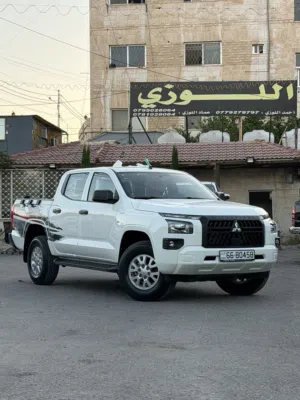 ميتسوبيشي L200 زيرو 2026 قير عادي لون ابيض للبيع قابل للبدل على بكمات