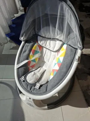 Gentle Rocking Baby Bouncer with Soothing Features like bluetooth connectivity and remote control.
