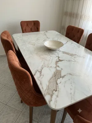 Elegant 8-Seater White Marble Dining Table with Premium Orange Chairs