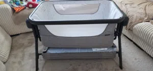 Electricity grey bedside bassinet/crib with storage shelf