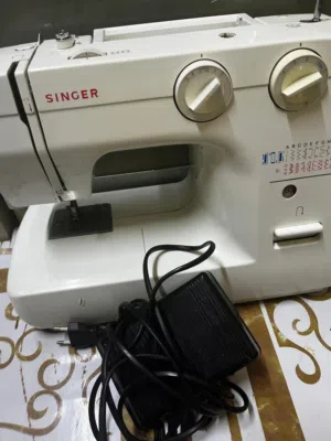 sweing machine for urgent sale, used for very less time. good company SINGER