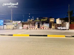 موقع تجاري للبيع في عويسيان على الشارع العام
