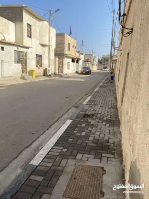 بيت قديم يباع قطعة مقابل معرض البصرة الدولي