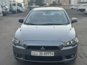 سيارة ميتسوبيشي لانسر 2015 موديل خليجي لون أزرق جاهزة للبيع