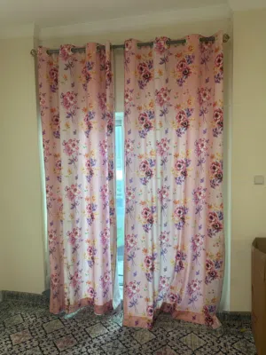 Pair of pink floral eyelet curtains - good condition