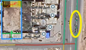موقع تجاري ممتاز أرض 2000 م2 فيها هنقر 350 م2 / طريق المطار