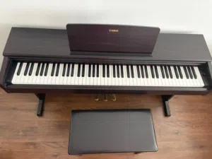 piano  dark brown in color- Yamaha brand