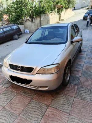 سيارة أوبل استرا GS موديل 2001 لون فضي للبيع رقم الهاتف