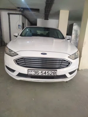 فورد فيوجن 2018 لون أبيض هايبرد مرخصة بحالة جيدة مع مواصفات أمريكية