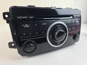 مسجل mazda cx-9 الاصلي CD CHANGER مفكوك عن سيارة بحال الوكالة للبيع