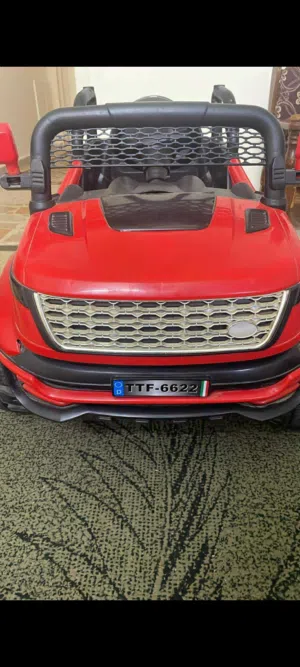 سياره كهربائيه شحن لون احمر