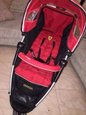 عربة أطفال ماركة فيراري