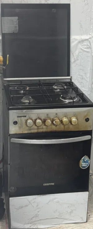 Gas oven with gas cylinder.