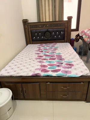 Queen sized Bed and mattress with storage spaces for sale
