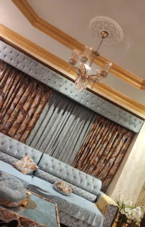 This is living room sofa set with 5 5 3 seater sofas with matching tables and matching curtains