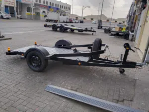 This is a Carretinhas Bauru ATV trailer, featuring a metal checker plate deck for loading small vehi
