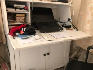 Study Table, IKEA make,  Solid Wood,  with Storage Shelves below.