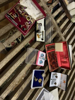 Cufflinks, pins and lighter.