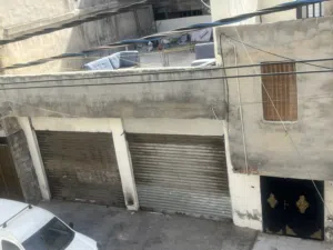 فرصه استثماريه في حي الامير حسن مخيم النصر (((((مخازن للبيع)))))