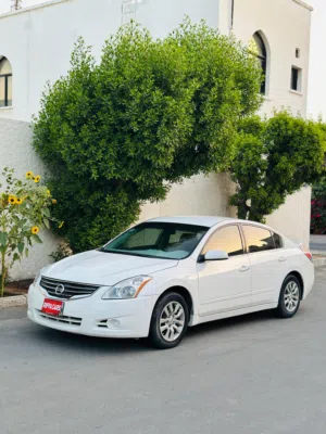 Nissan Altima Year-2012 Engine-2.5L Colour-White Odo-145,000km  Well maintained -Riffacars Manama