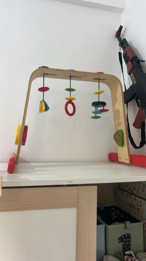 Wooden baby gym toy.