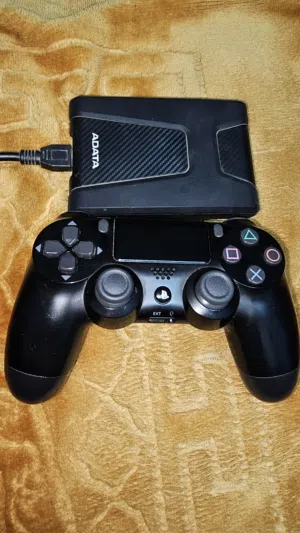 يدة بلايستيشن اصلية مستعملة+هارد ديسك خارجي مستعمل 1TB HDD