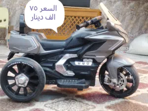 دراجه اطفال كهربائية مع كيس ملاكمه