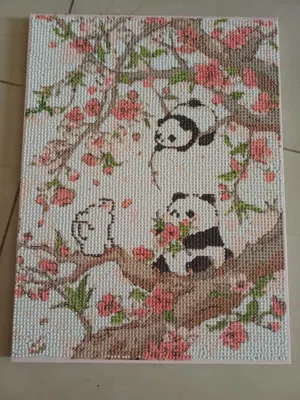Cute panda painting with dots filled in by hand