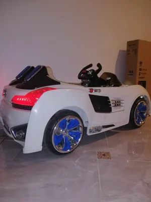 TOW SEATER KIDS CAR , RECHARGEABLE.