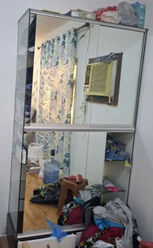 Glass almirah with mirror glass and two portions with shelves