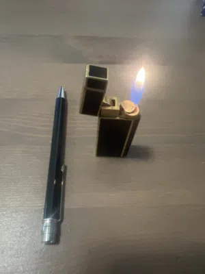 Cartier pen and lighter  New pen  Used and excillant lighter  Black set