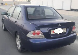 Mitsubishi Lancer model 2011 well maintained 1.6L  With Alloyrims Tubeless tyres CD player USB all.