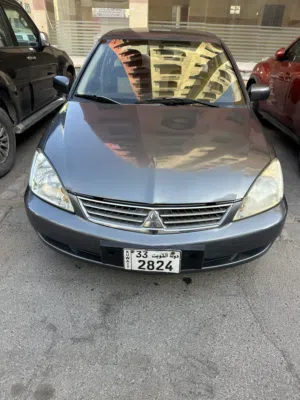 بيع سريع لسفر ضروري لانسر بومه 2009 مكينة 1600 سي سي ماشية 324 الف شرط الفحص  جير مكينة شاصي  مكيف
