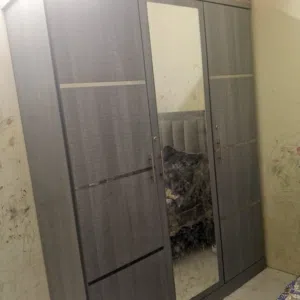 Bed with cupboard