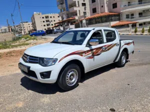بكم ميتسوبيشي L200 موديل 2015 بنزين بحاله الوكاله نخب اول فحص 7 كامل جير عادي  ( واطي )