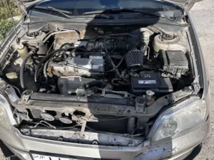 ميتسوبيشي لانسر 2003 موديل ذهبي بمحرك بنزين بحالة جيدة ومرخصة
