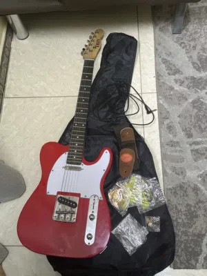 Brand New Bright Red Electric guitar along with strings, case, wires, and hooks
