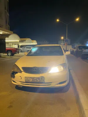 تويوتا كامري 2004 موديل XLI بيضا، دفع أمامي، حالة ممتازة، بدون حوادث، خليجية