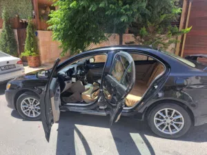 لانسر EX فراشة للبيع لون اسود مالك 1