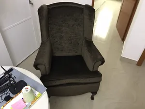 Two comfy chairs in brown