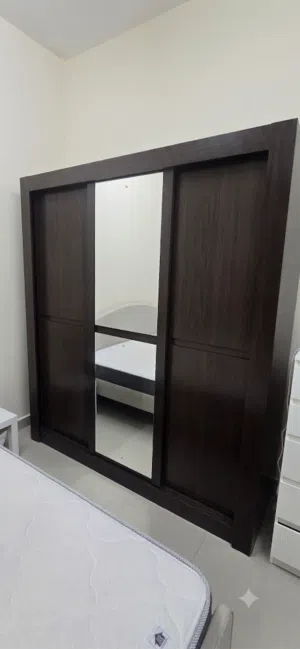 Dark wood sliding wardrobe with mirror - good condition