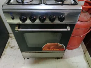 Four-burner gas stove, working oven and grill, with hose, regulator, and gas cylinder, 22 kg, price