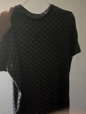 One grey checkered Louis Vuitton  ‘Next’ shirt