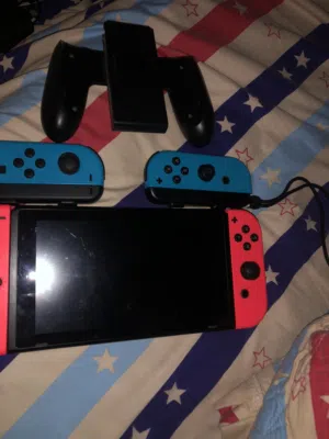 Nintendo switch with two extra joy cons and a controller with 16 gb micro sd