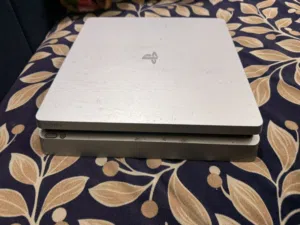 PlayStation 4 with two controllers