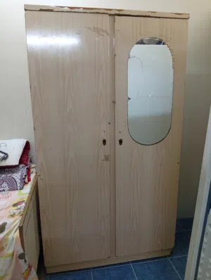 double bed with mattress (180x190 cm) _ made from metal  . Bahraini wooden wardrobe (2 doors