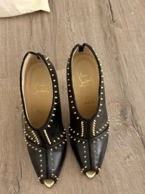 } Authentic Christian Louboutin spike heels.