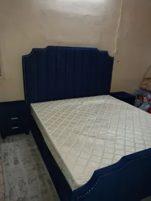 King size 180x200 bed with 2 said table for sale good condition in al ain