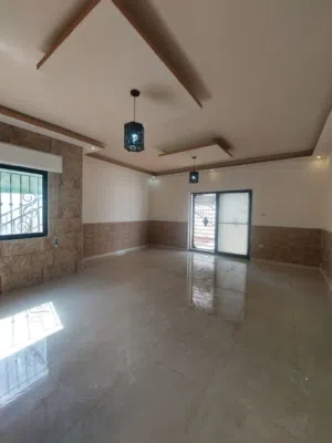 شقة أرضية مميزة مع حديقة وترس وكراج خاص للبيع – الجبيهة، حي أم زويتينة